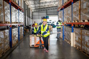 Worker pulling cardboard boxes at warehouse 2023 11 27 05 14 11 utc min