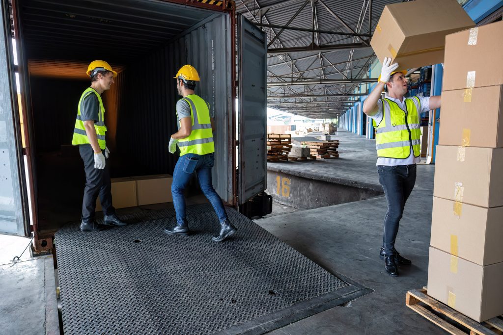 Workers unloading a container 