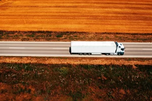 White truck on highway through countryside landsca 2024 12 06 00 57 36 utc